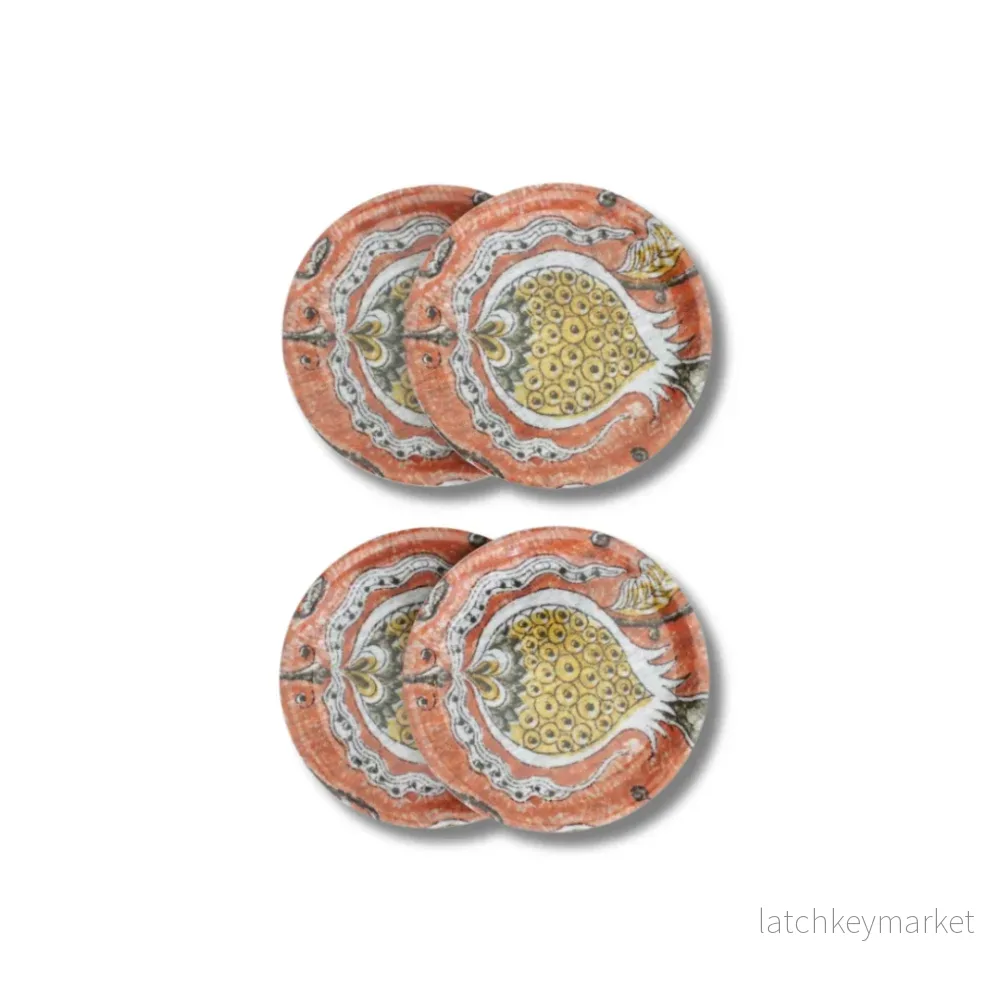 Glasnderlägg med granatäppletryck i orange