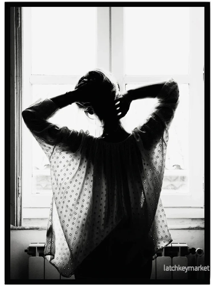Poster Woman in front of a window Poster Woman in front of a window