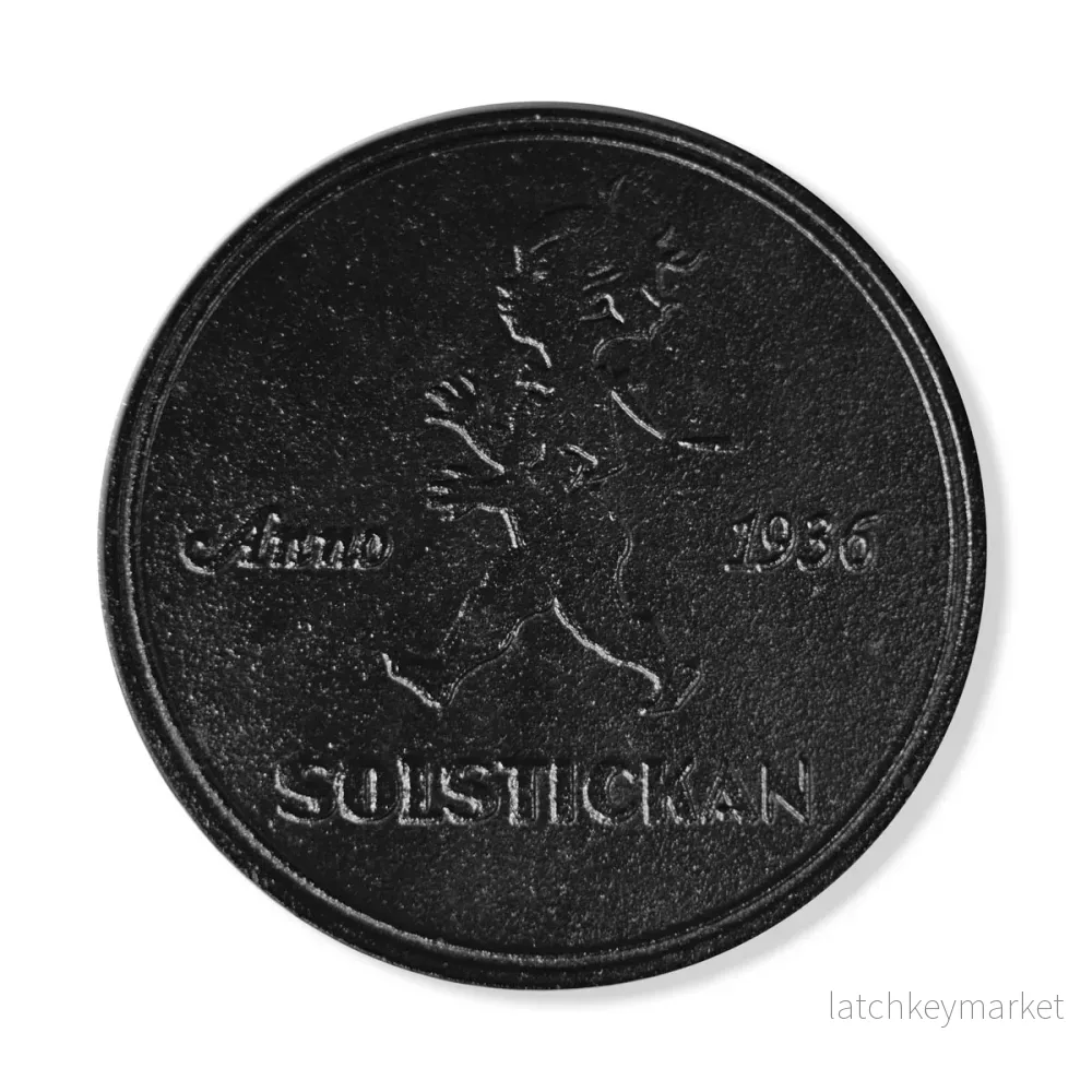 Solstickan grytunderlägg i gjutjärn svart